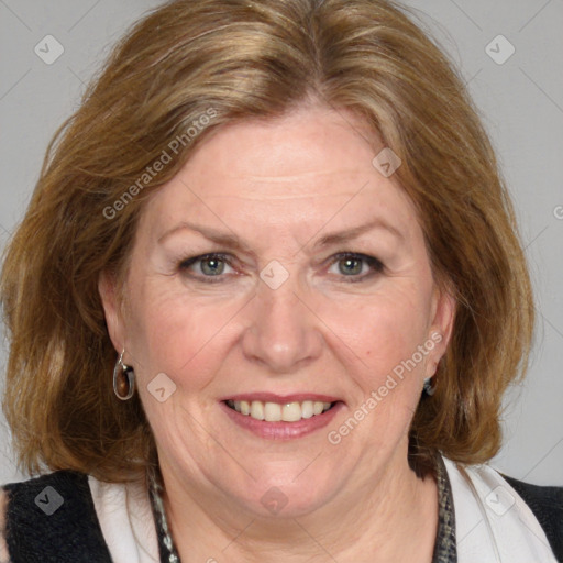 Joyful white adult female with medium  brown hair and blue eyes