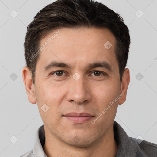 Joyful white adult male with short  brown hair and brown eyes