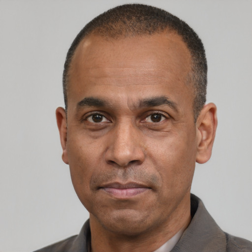 Neutral latino adult male with short  black hair and brown eyes