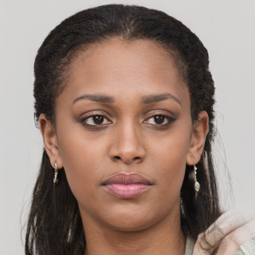 Neutral latino young-adult female with long  brown hair and brown eyes