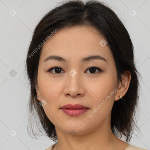 Joyful asian young-adult female with medium  brown hair and brown eyes