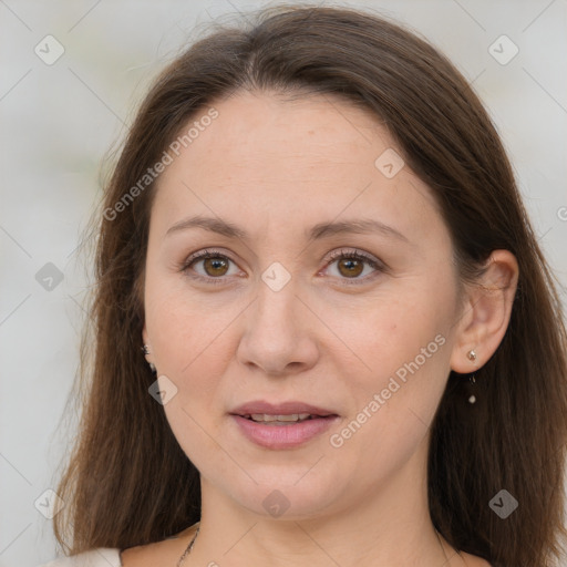 Joyful white adult female with long  brown hair and brown eyes