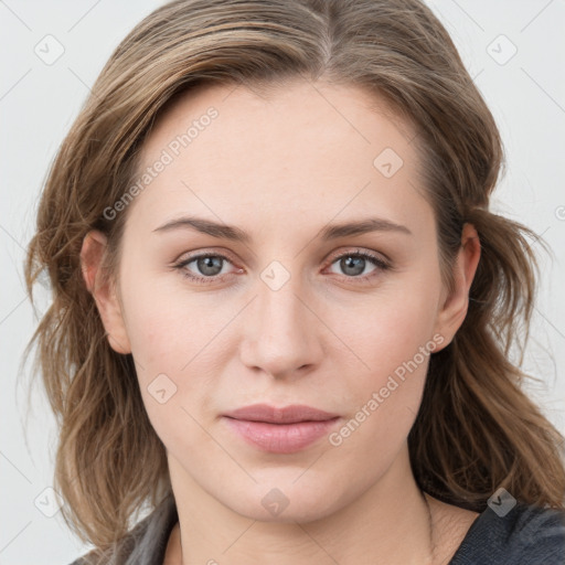 Joyful white young-adult female with medium  brown hair and blue eyes