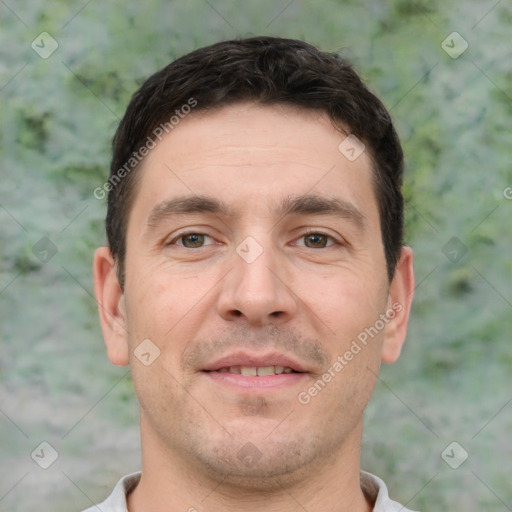 Joyful white young-adult male with short  brown hair and brown eyes