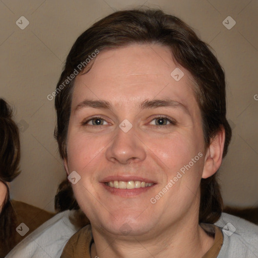 Joyful white adult female with medium  brown hair and brown eyes