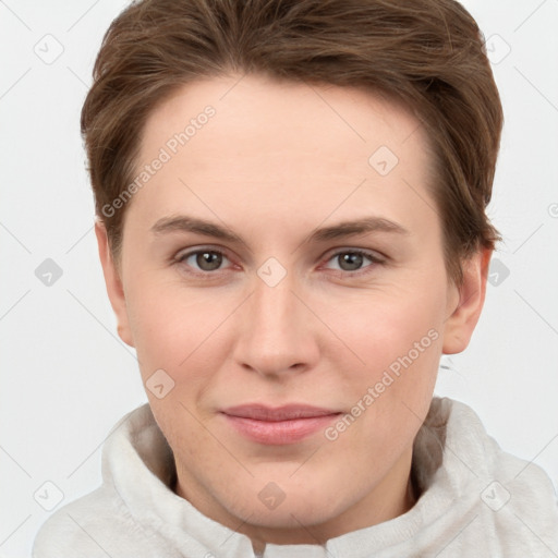 Joyful white young-adult female with short  brown hair and grey eyes