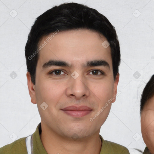 Joyful white young-adult male with short  black hair and brown eyes