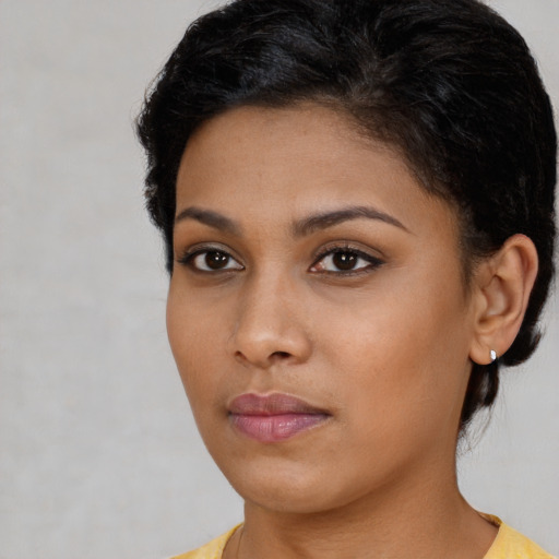 Neutral black young-adult female with short  brown hair and brown eyes