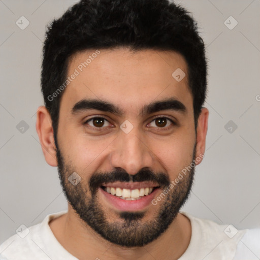 Joyful white young-adult male with short  black hair and brown eyes