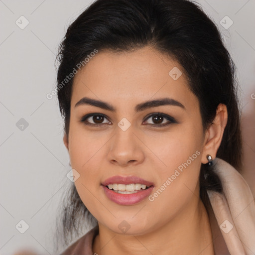 Joyful latino young-adult female with long  brown hair and brown eyes