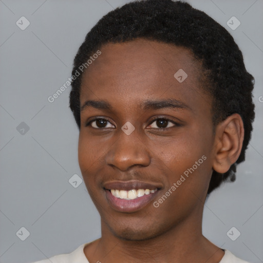 Joyful black young-adult female with short  black hair and brown eyes