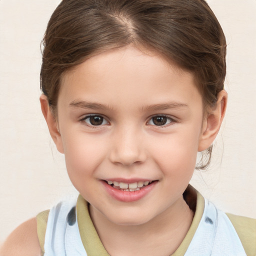 Joyful white child female with short  brown hair and brown eyes