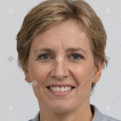 Joyful white adult female with short  brown hair and grey eyes