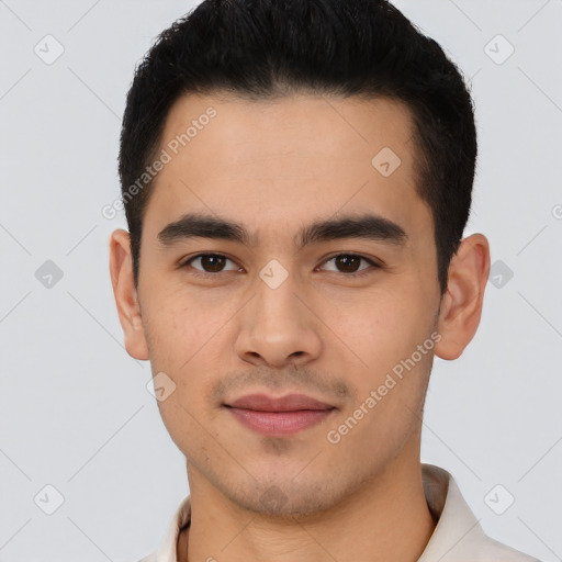 Joyful latino young-adult male with short  black hair and brown eyes