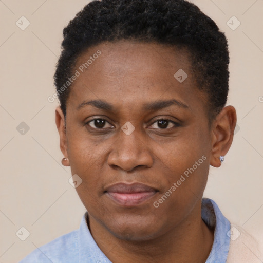 Joyful black adult female with short  black hair and brown eyes