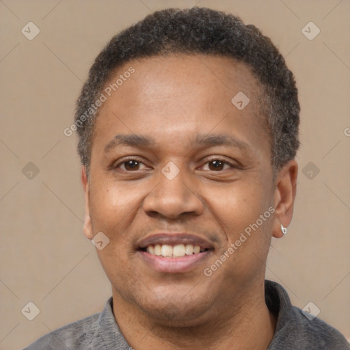 Joyful latino adult male with short  black hair and brown eyes