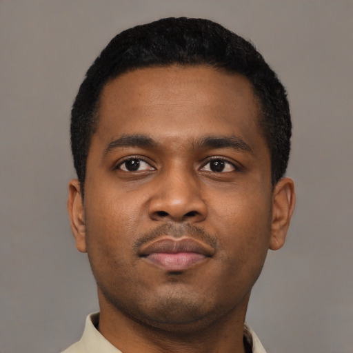Neutral black young-adult male with short  black hair and brown eyes