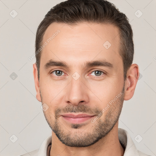 Joyful white young-adult male with short  brown hair and brown eyes