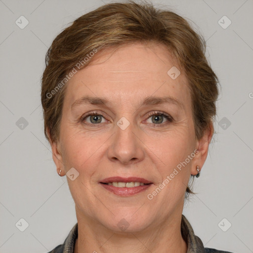 Joyful white adult female with medium  brown hair and grey eyes