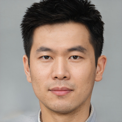 Neutral asian young-adult male with short  brown hair and brown eyes