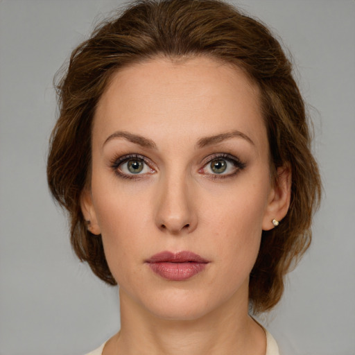 Neutral white young-adult female with medium  brown hair and green eyes