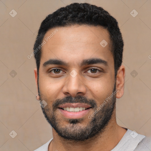 Joyful latino young-adult male with short  black hair and brown eyes