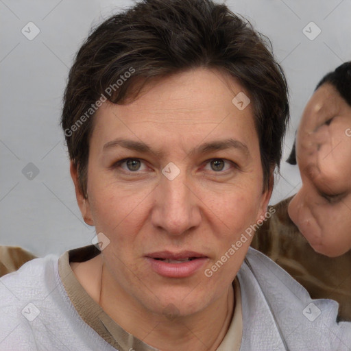 Joyful white adult female with short  brown hair and brown eyes