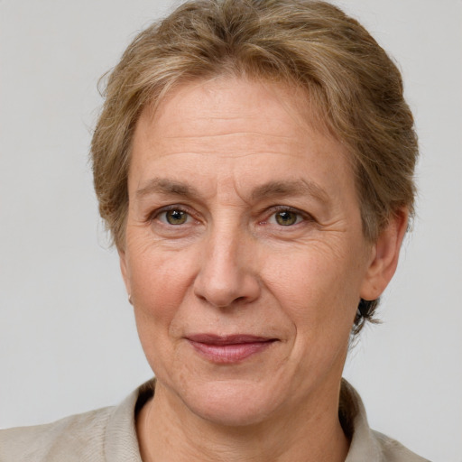 Joyful white middle-aged female with short  brown hair and brown eyes