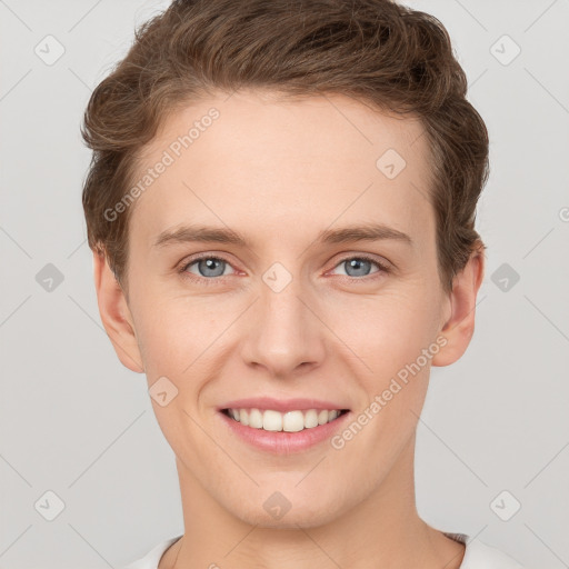 Joyful white young-adult female with short  brown hair and grey eyes