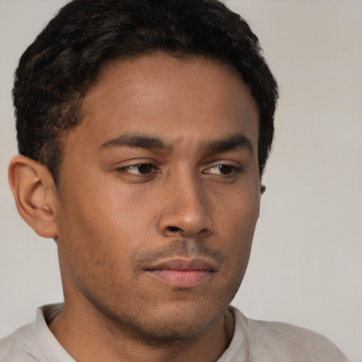Neutral latino young-adult male with short  brown hair and brown eyes