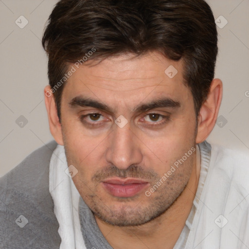 Joyful white adult male with short  brown hair and brown eyes