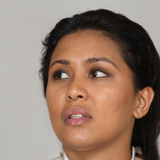 Joyful asian young-adult female with medium  black hair and brown eyes