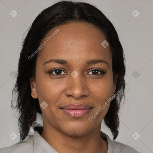 Joyful black adult female with medium  brown hair and brown eyes