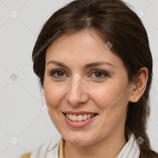 Joyful white adult female with medium  brown hair and brown eyes