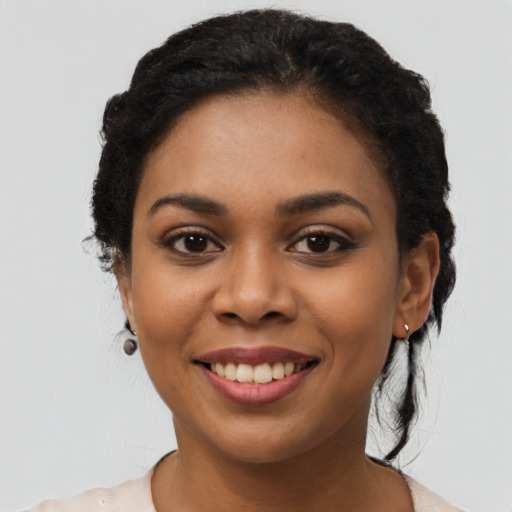 Joyful latino young-adult female with long  black hair and brown eyes