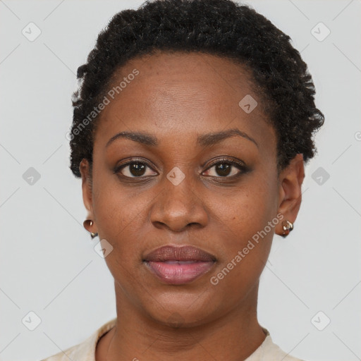 Joyful black young-adult female with short  brown hair and brown eyes