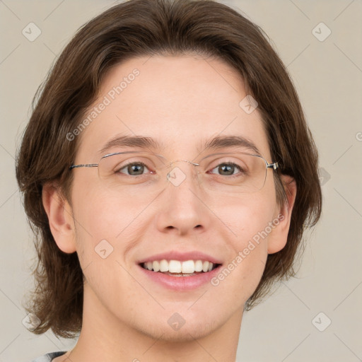 Joyful white adult female with medium  brown hair and green eyes