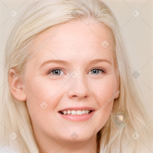 Joyful white young-adult female with long  blond hair and blue eyes