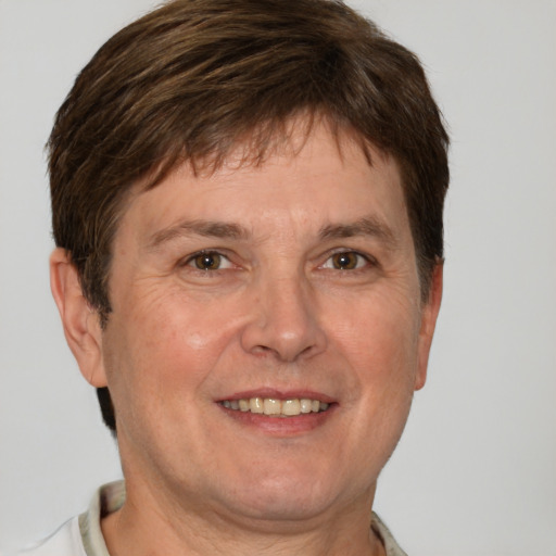 Joyful white adult male with short  brown hair and grey eyes