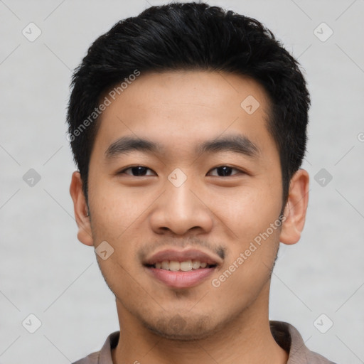 Joyful asian young-adult male with short  black hair and brown eyes