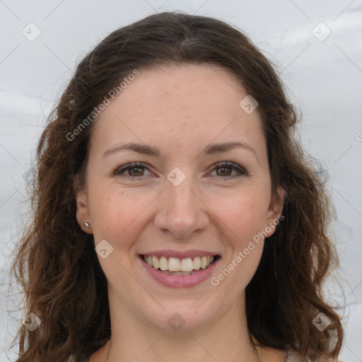 Joyful white adult female with long  brown hair and brown eyes