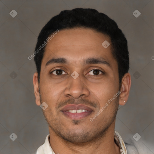 Joyful latino young-adult male with short  black hair and brown eyes