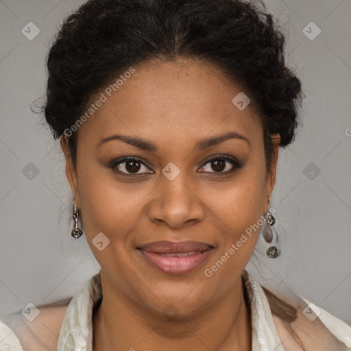 Joyful black adult female with short  brown hair and brown eyes