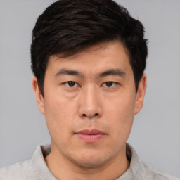 Neutral asian young-adult male with short  brown hair and brown eyes