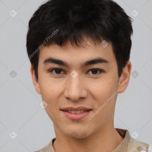 Joyful asian young-adult male with short  brown hair and brown eyes