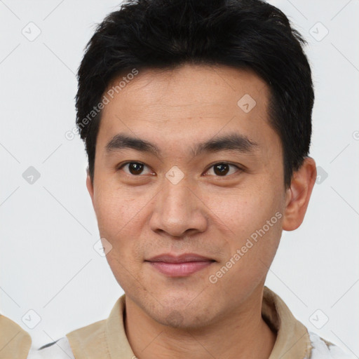 Joyful white young-adult male with short  black hair and brown eyes