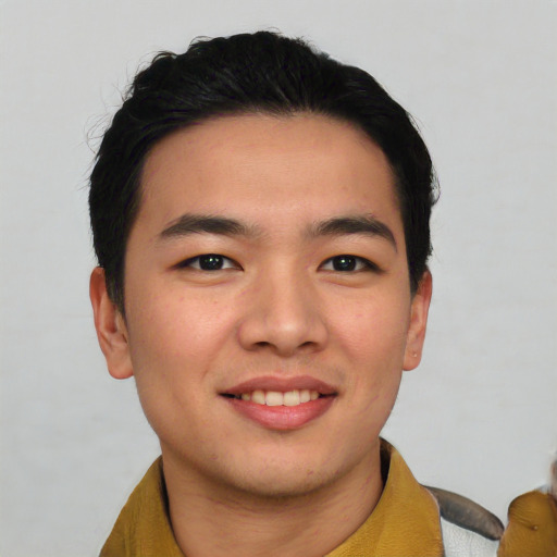 Joyful white young-adult male with short  black hair and brown eyes