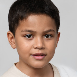 Joyful white child male with short  brown hair and brown eyes