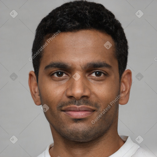 Joyful black young-adult male with short  black hair and brown eyes