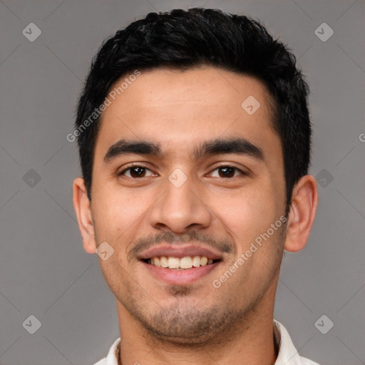 Joyful latino young-adult male with short  black hair and brown eyes